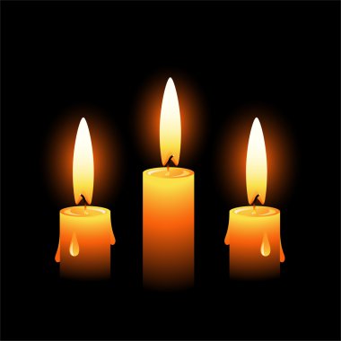 Three vector candles on a black backgrou clipart