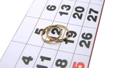 Wedding rings on a calendar clipart