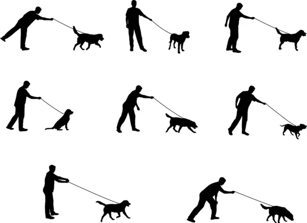 stock vector Walking the dog silhouettes