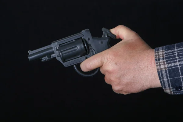 9mm gun in man's hand aiming — Stock Photo, Image