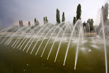 Waterworks in nice park clipart