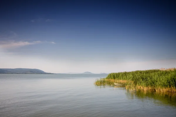 Beautiful lake with boat — Stock Photo, Image