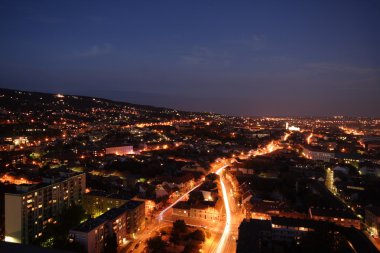 Cityscape at night with moonlight clipart