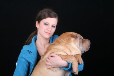 Beautiful girl with sharpei dog