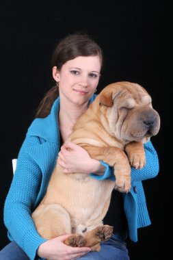 Beautiful girl with sharpei dog