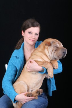 Beautiful girl with sharpei dog