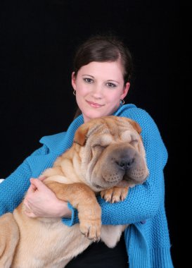 Beautiful girl with sharpei dog