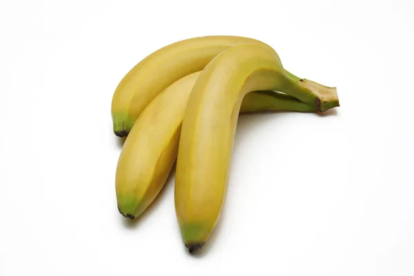 Three bananas on the white background — Stock Photo, Image