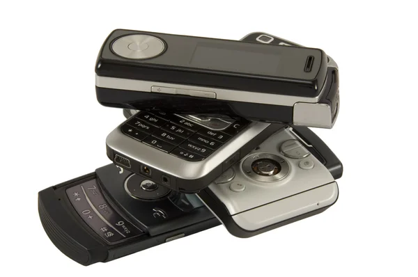 Cuatro teléfonos móviles — Foto de Stock