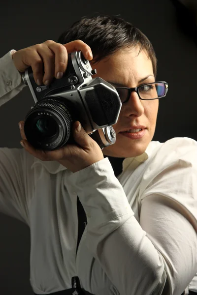Beautiful woman with camera — Stock Photo, Image