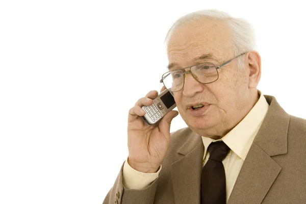 Зрелый бизнесмен, пользующийся сотовым телефоном — стоковое фото