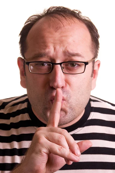 Mann mit Brille zeigt Schweigezeichen - sh Stockfoto