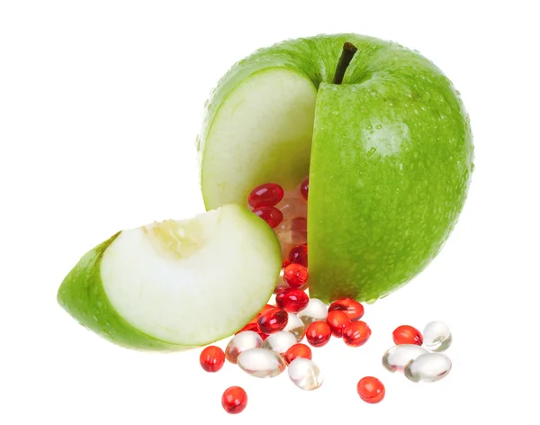 Apple with vitamin capsules — Stock Photo, Image