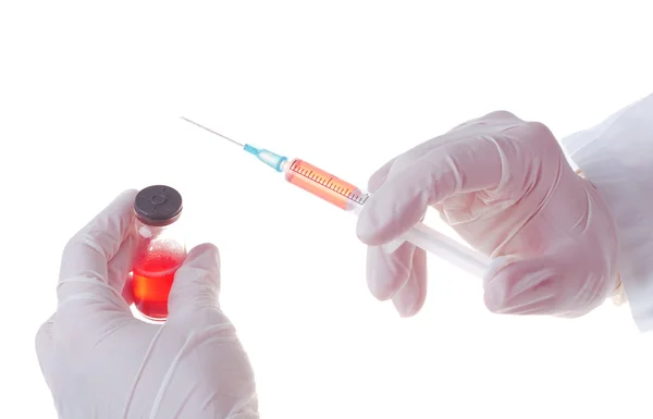 Medic holding a syringe for injection — Stock Photo, Image