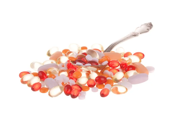 Spoon with pills — Stock Photo, Image