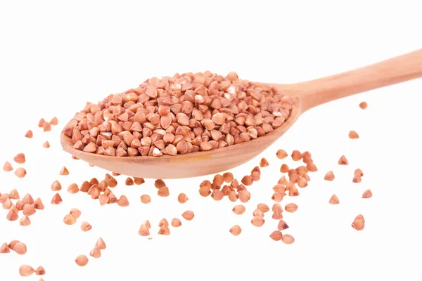 Buckwheat in a wooden spoon — Stock Photo, Image