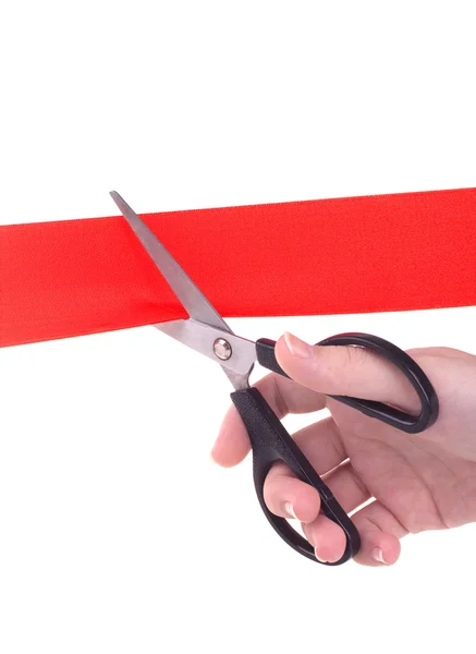 stock image Hand with scissors cutting red ribbon