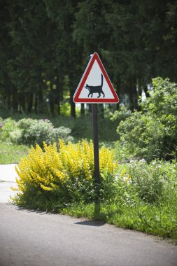 Road warning sign - cats are crossing here clipart