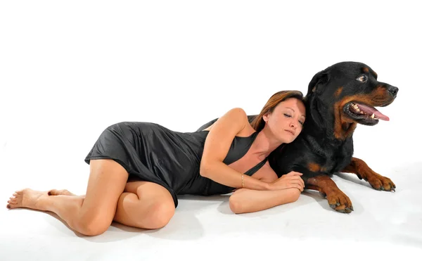 Sleeping woman and rottweiler — Stock Photo, Image