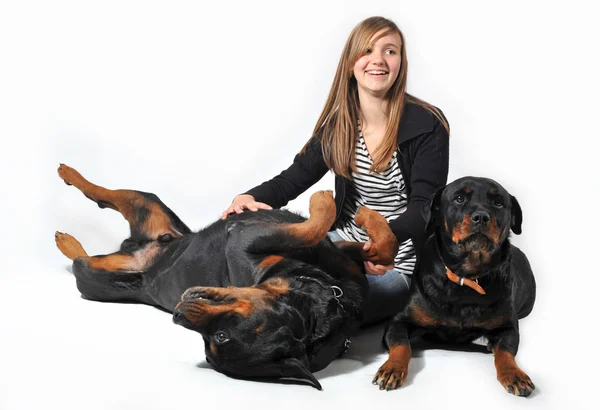 Teen and rottweilers — Stock Photo, Image