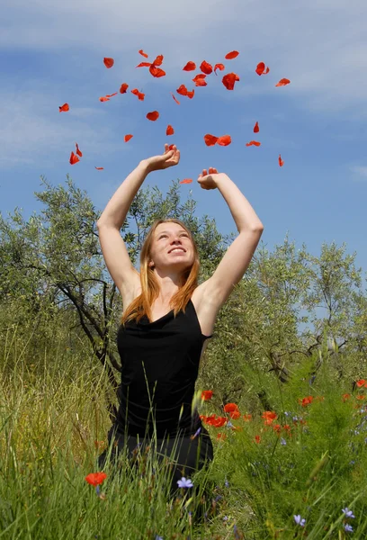 Teenager and poppies — Stock Photo, Image