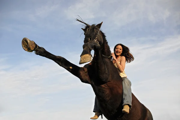 Rearing stallion and laughing girl — Stock Photo, Image