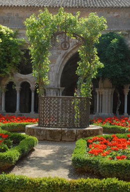 Old well in an abbey clipart