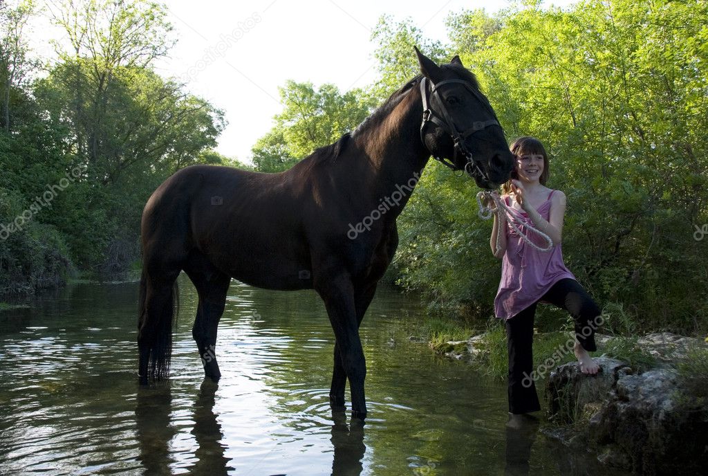 Child and horse in river