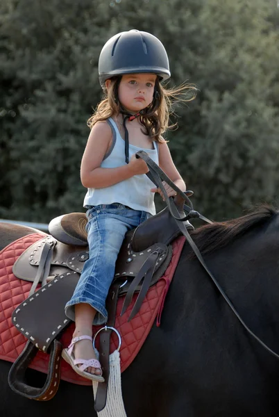 Baby riding girl — Stock Photo, Image