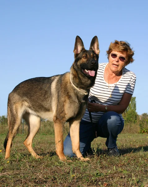 German shepherd and woman — Stock Photo, Image