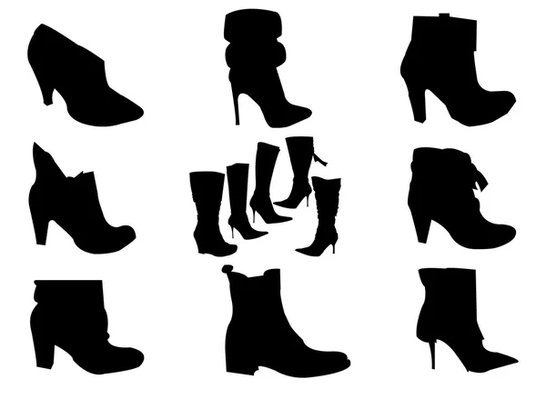 Siluetas de botas negras — Vector de stock