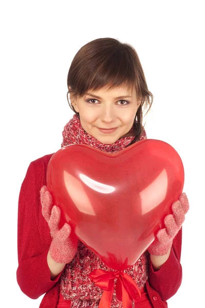 Жінка з червоною серцевою кулею — стокове фото