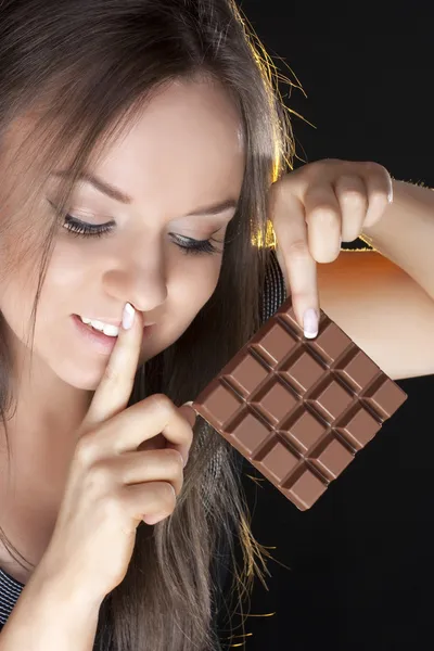 Beautiful girl with a chocolate — Stock Photo, Image