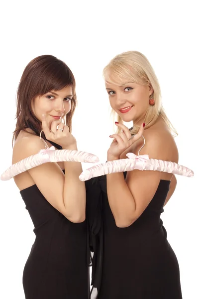 Two girls with pink hangers — Stock Photo, Image