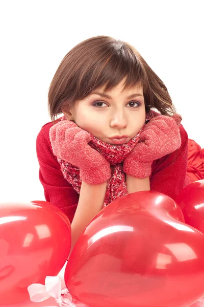 Menina com balão de coração vermelho — Fotografia de Stock