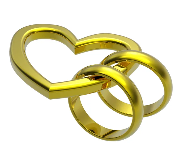 两个黄金结婚戒指与金心 — 图库照片