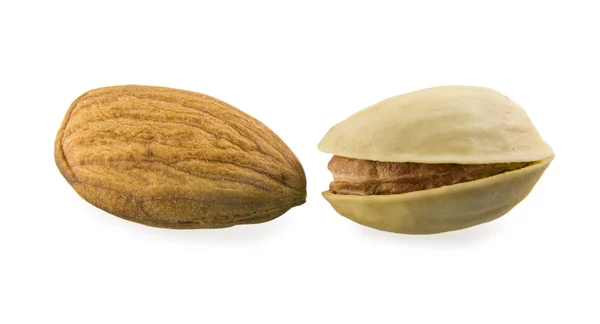 Almonds against a pistachio — Stock Photo, Image