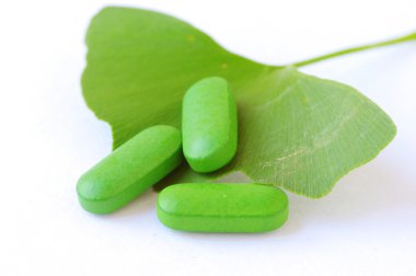 Ginkgo Biloba and herbal pills clipart