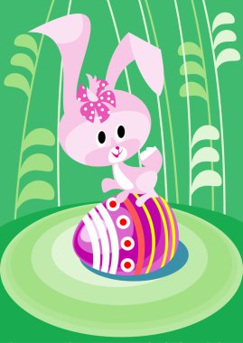 Easter bunny on the greene grass clipart