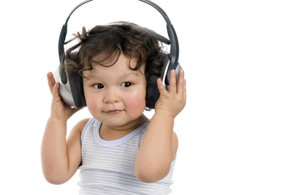 Baby med hörlurar. — Stockfoto