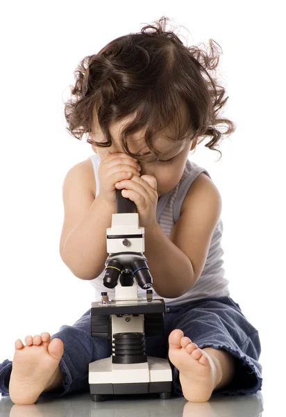 Baby with microscope. — Stock Photo, Image
