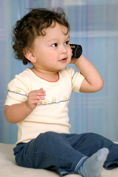 Baby with telephone. — Stock Photo, Image