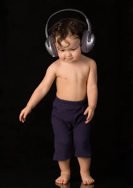 Dancing baby with headphones. — Stock Photo, Image