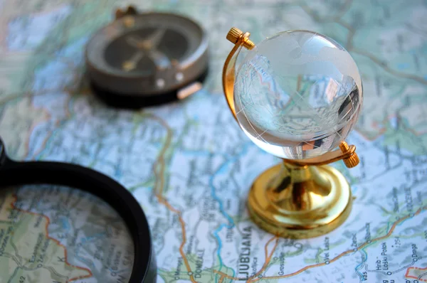 Map, globe and magnifying glass — Stock Photo, Image