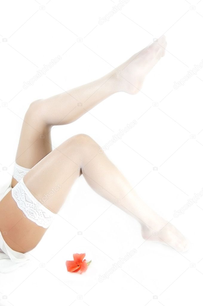 Beautiful woman's legs in white lingerie