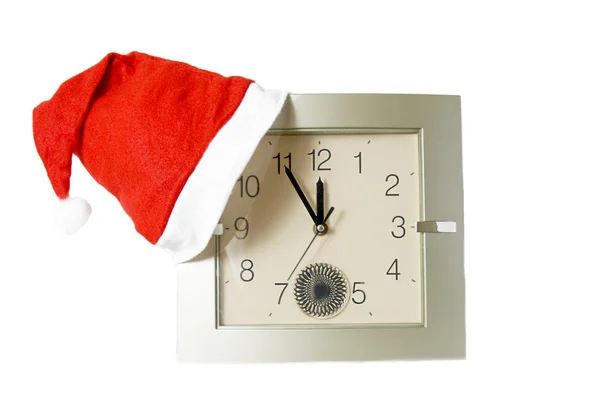 Santa red cap on clock — Stock Photo, Image