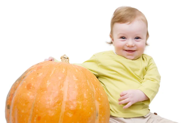 Sonriente bebé jugando con la calabaza — Foto de Stock