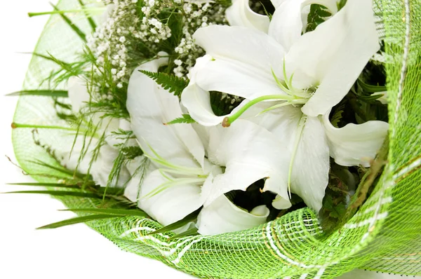 Ramo de lirios blancos en textil verde —  Fotos de Stock