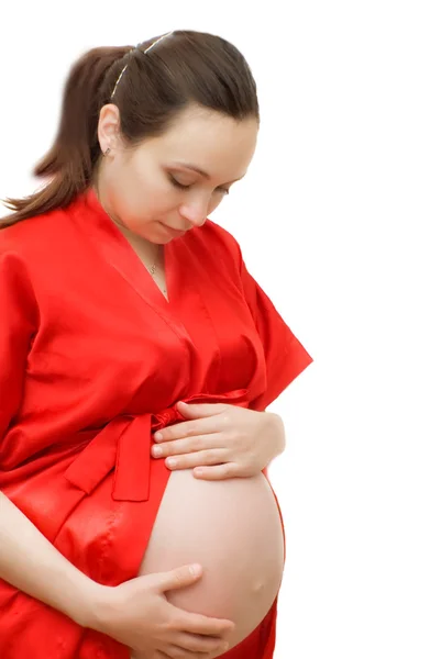 Embarazada mujer mirando en su vientre —  Fotos de Stock