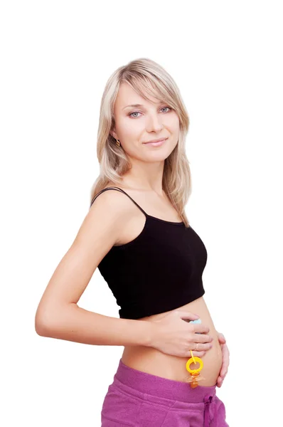 Mujer embarazada sosteniendo maniquí — Foto de Stock